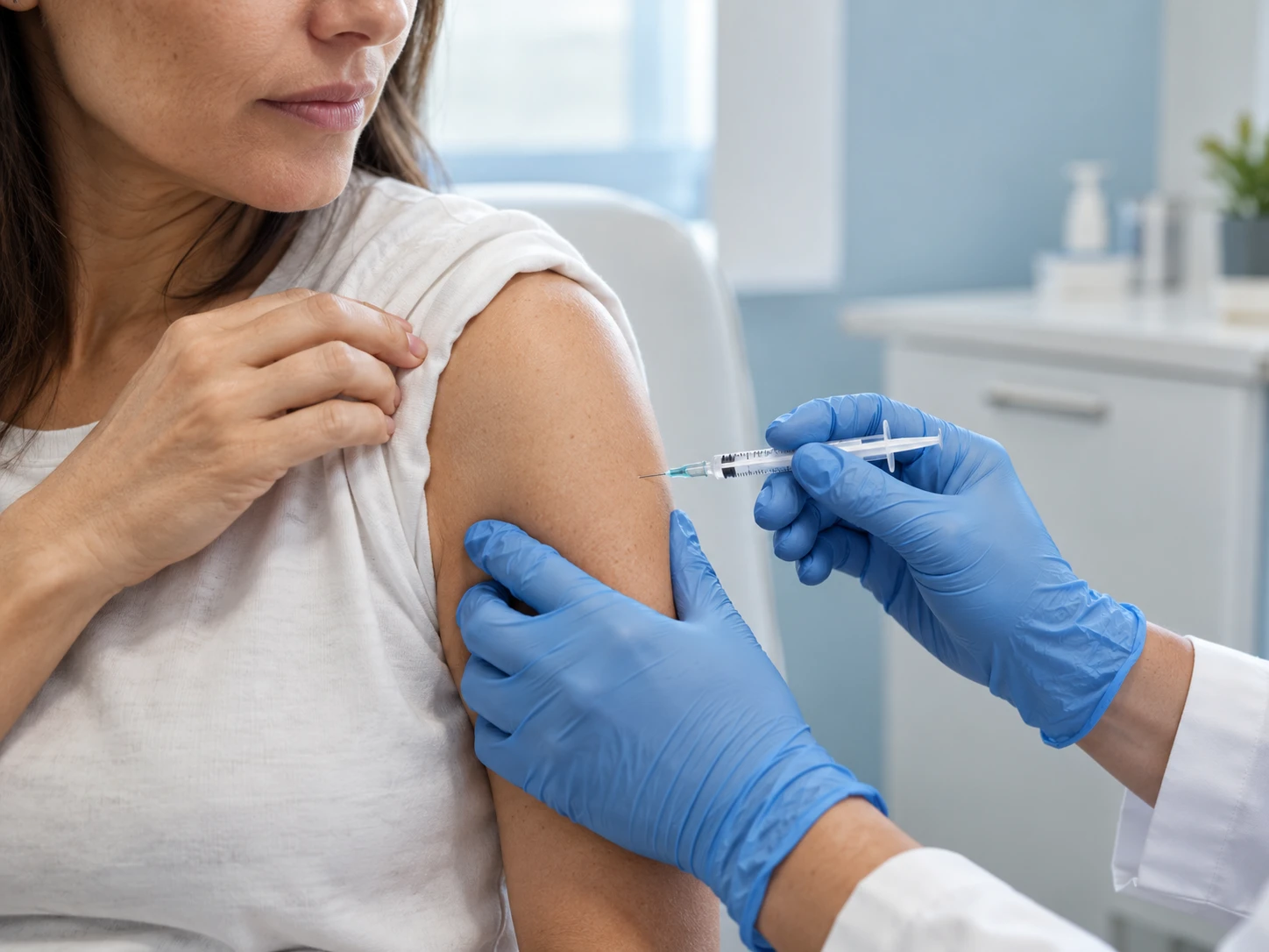 Illustrative image of an upper-arm injection in a clinical setting